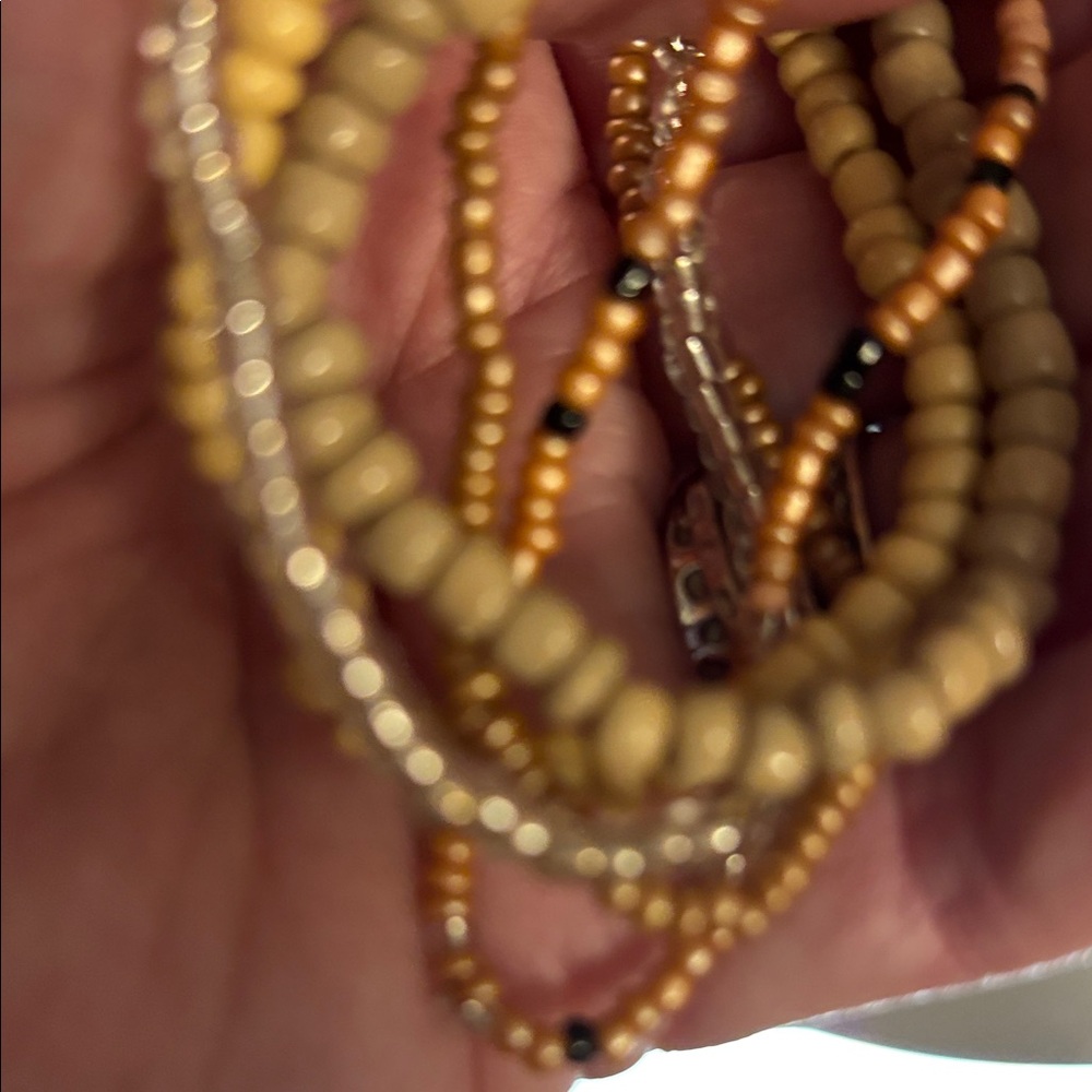 Chic Beaded Bracelet Set of 6 in Gold and Cream colors and stretchy.